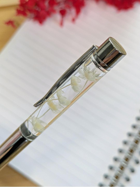 Stylo fleur immergée blanche