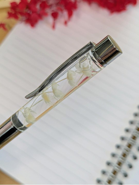 Stylo fleur immergée blanche