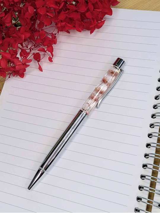 Stylo fleur immergée rose