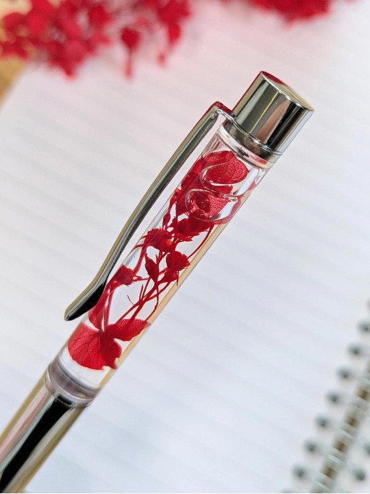 Stylo fleur immergée rouge