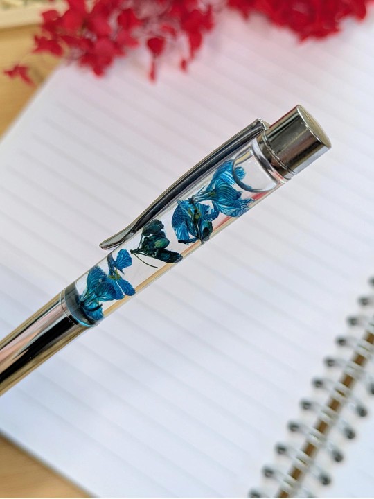 Stylo fleur immergée turquoise