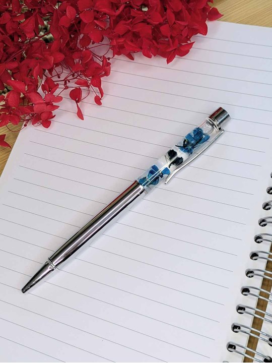 Stylo fleur immergée turquoise Stylo fleur immergée turquoise