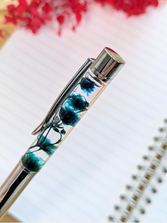 Stylo fleur immergée turquoise