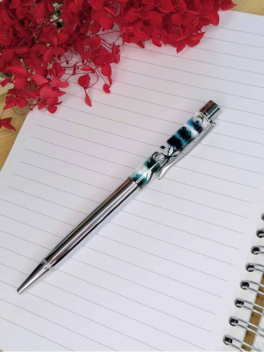 Stylo fleur immergée turquoise Stylo fleur immergée turquoise